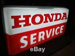 Lighted double sided sign that displays Honda Service