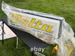 VINTAGE 1990s DELTA TIRE SIGN DOUBLE SIDED ILLUMINATED NEW IN WRAPPING